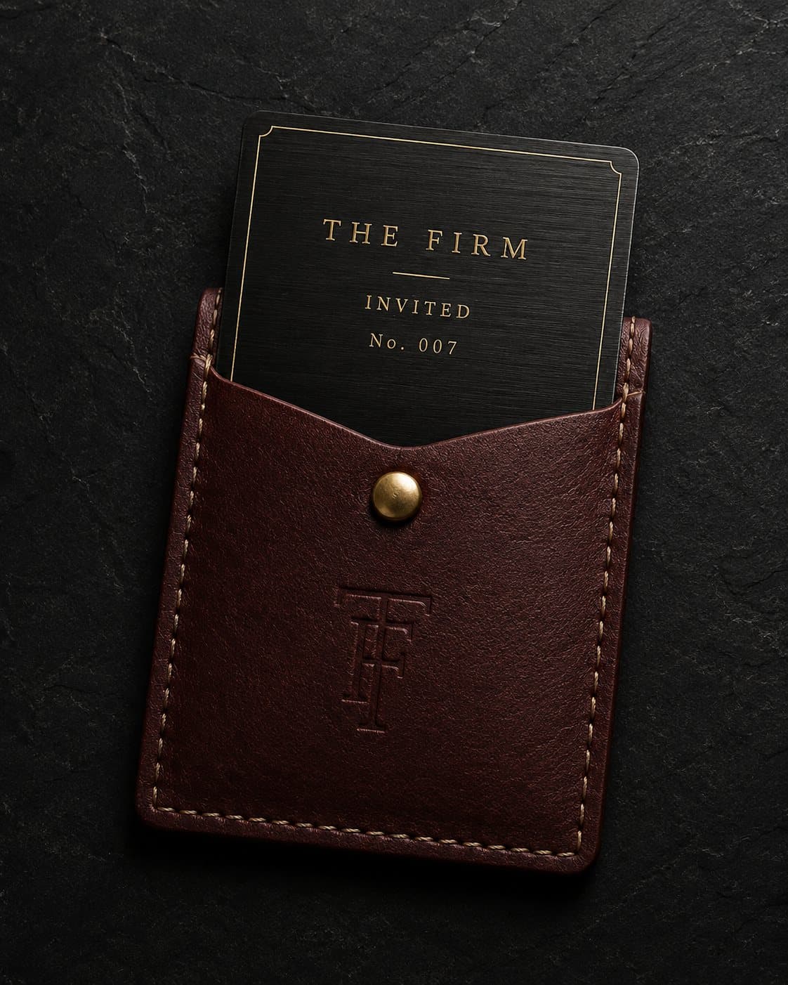 The membership card drawn from its oxblood leather pouch
